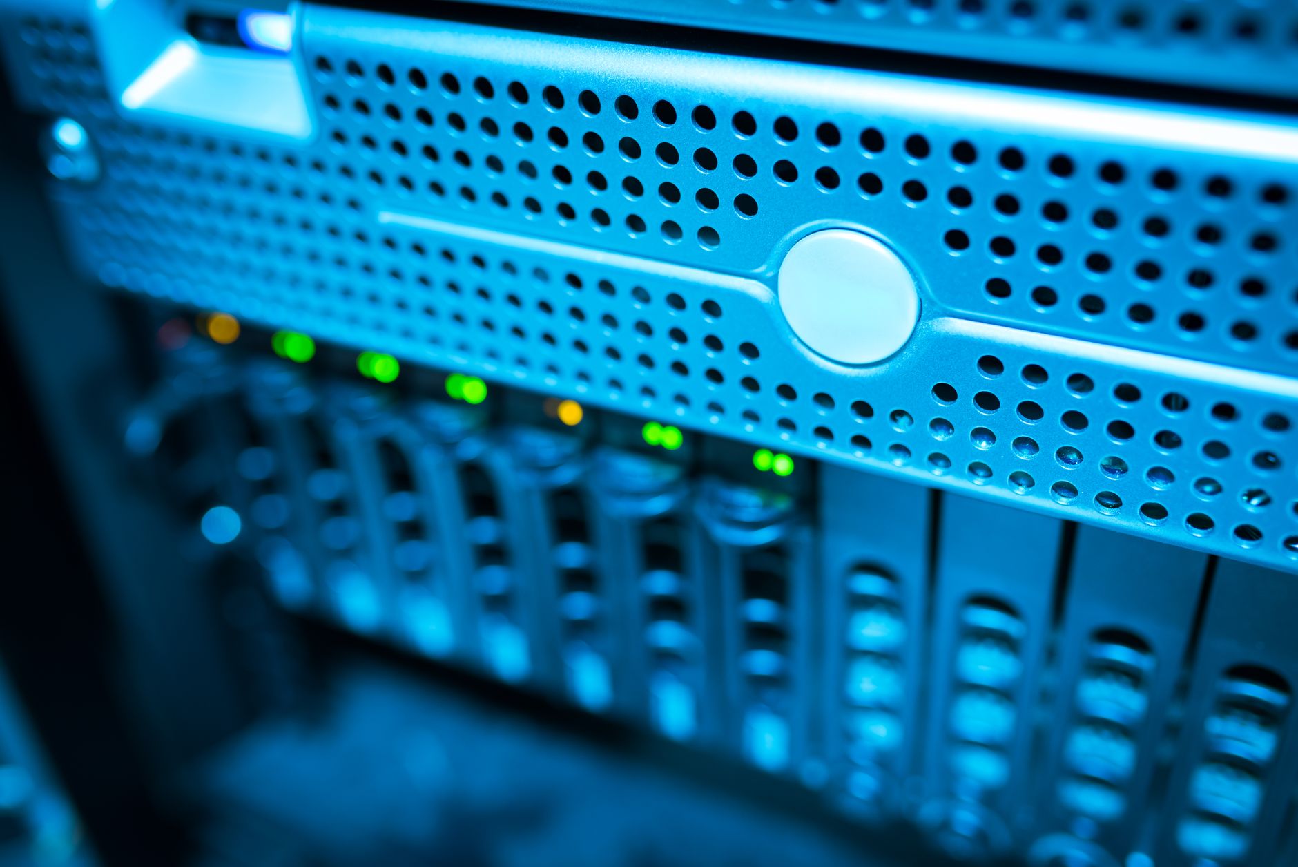 Focused view of a modern data server rack with blinking lights in