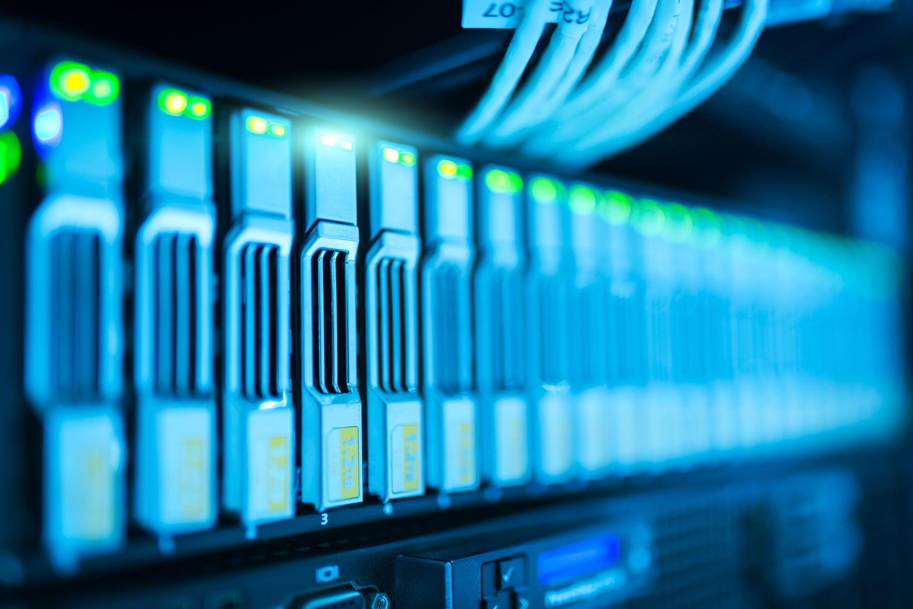 Detailed image of a server rack with glowing lights in a modern