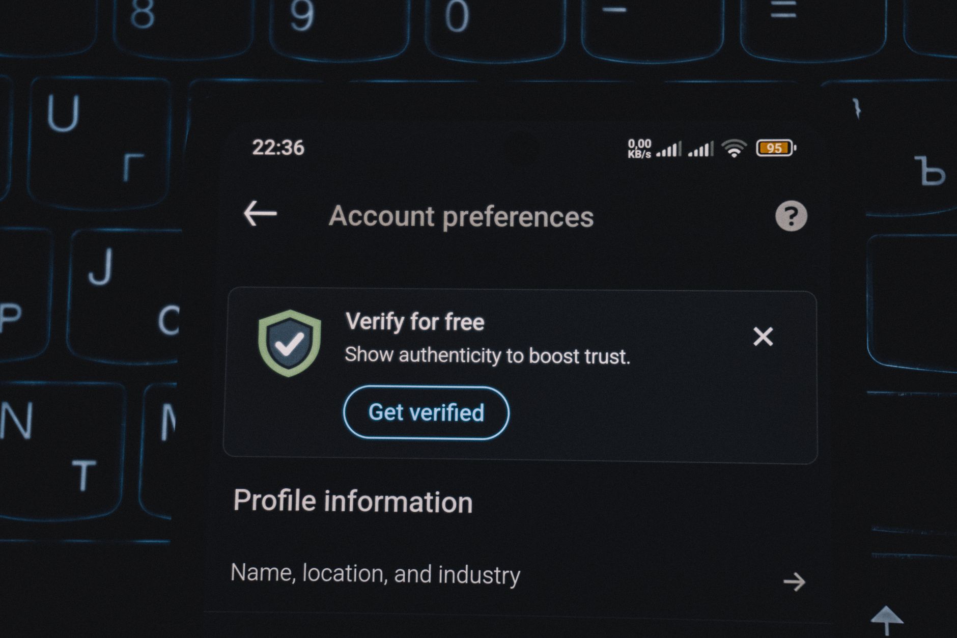 Close-up of a smartphone screen displaying account verification alert. Ideal for security