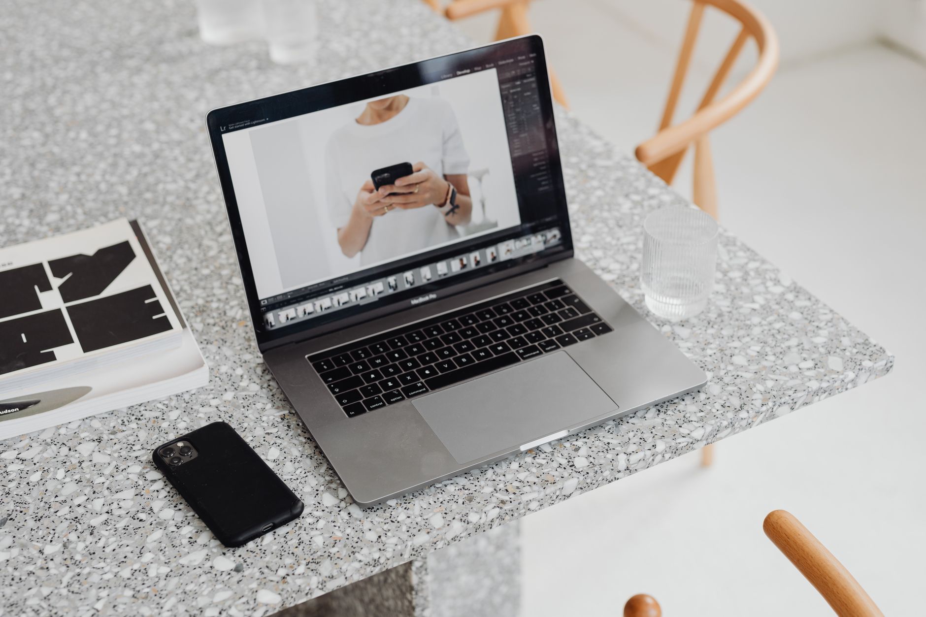 High angle view of a sleek laptop and smartphone on a marble
