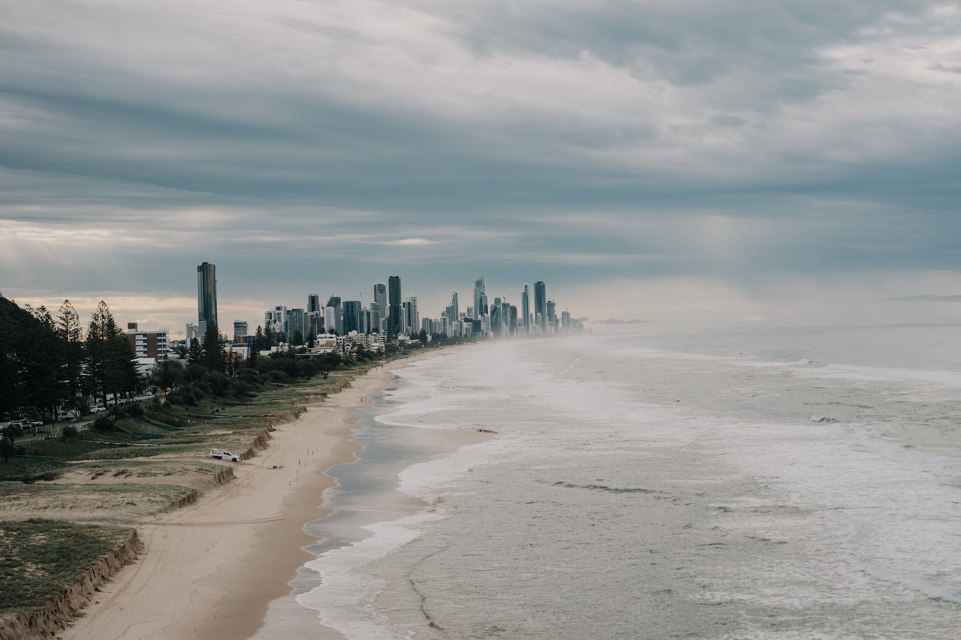 A dramatic view of Gold Coast, Australia, with a cloudy sky and