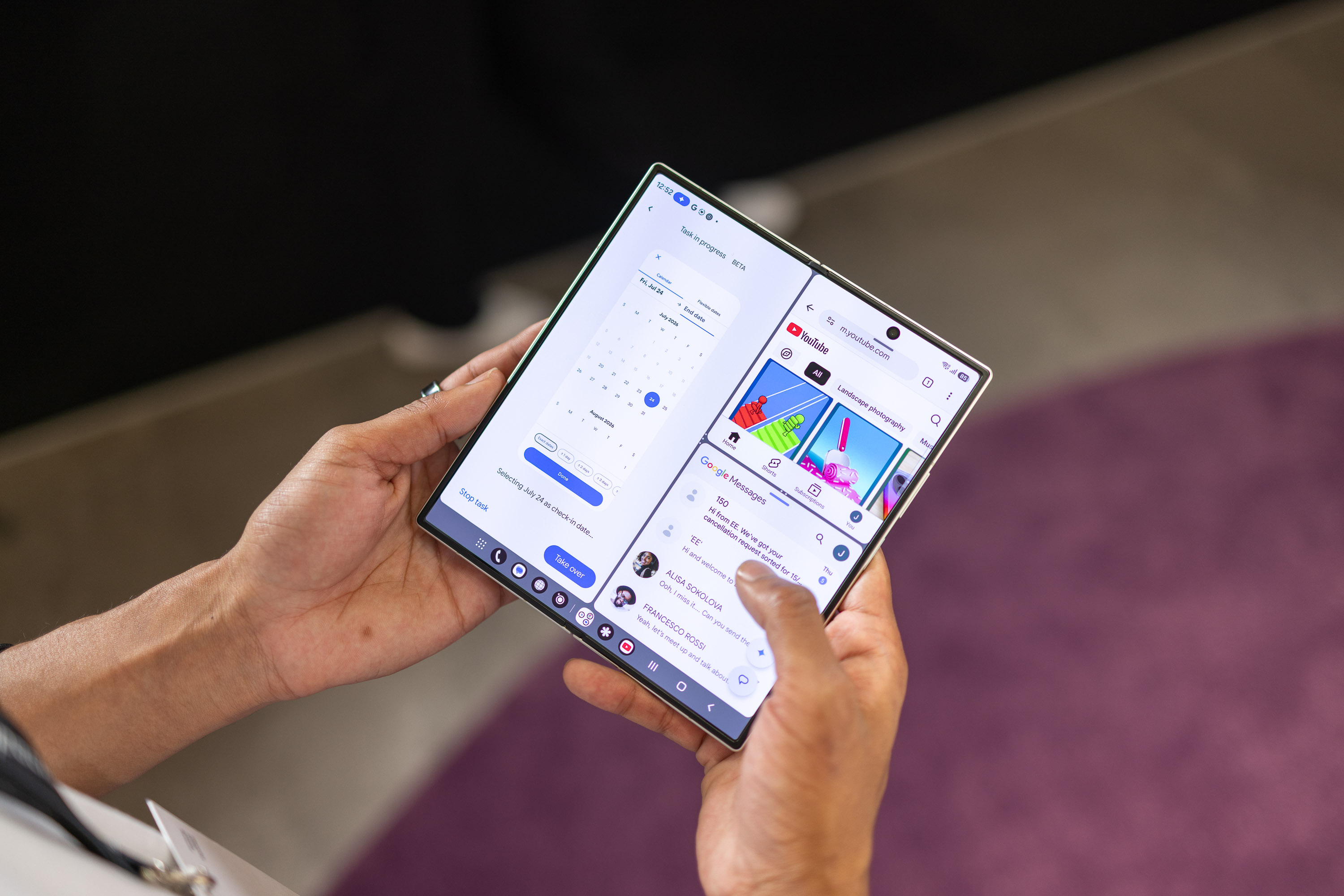 A foldable phone unfolded to show its large screen, with two apps