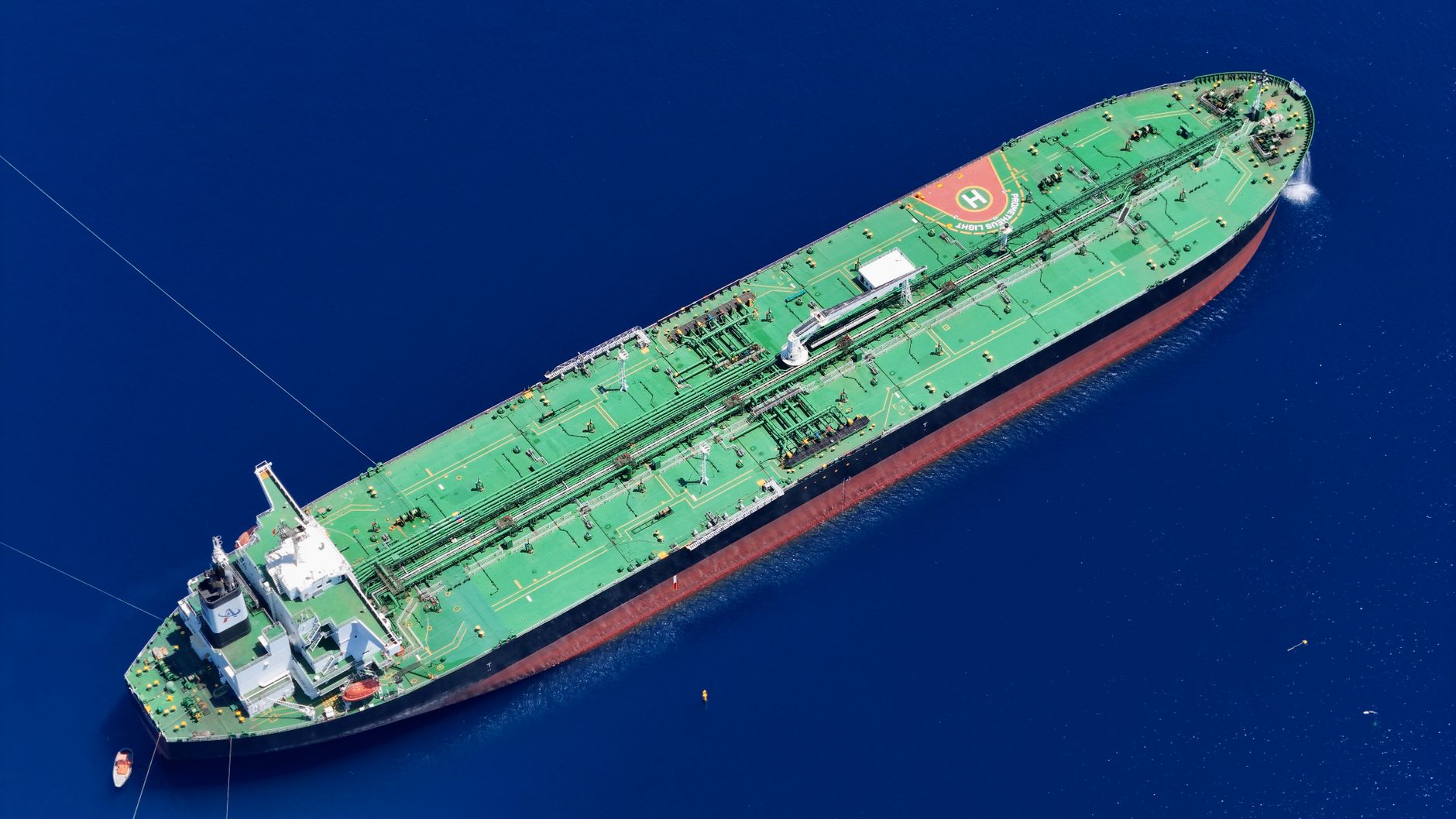 Aerial shot of an oil tanker sailing in the ocean near Vado