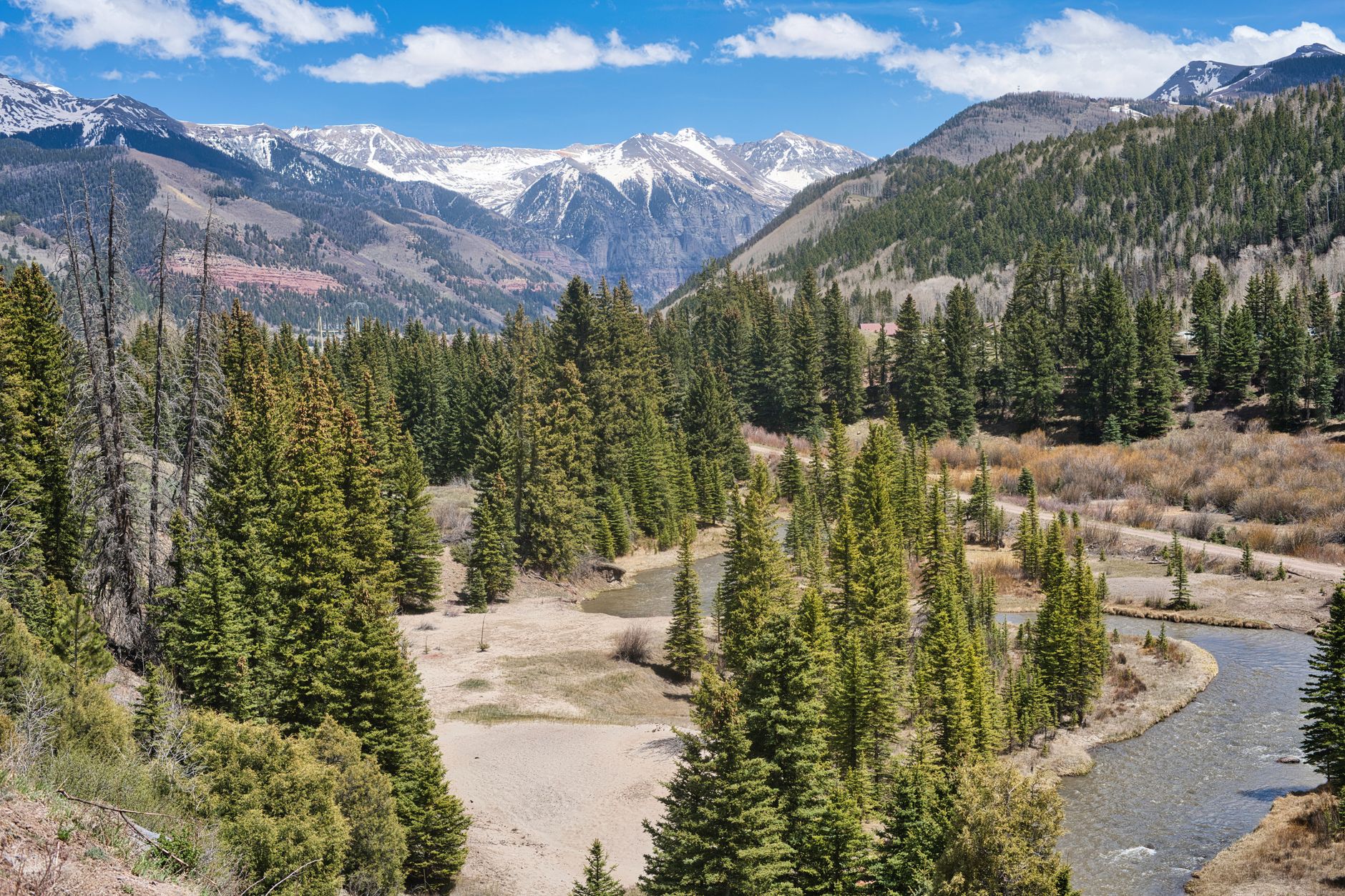 Scenic view of the majestic San Juan Mountains with lush forests and