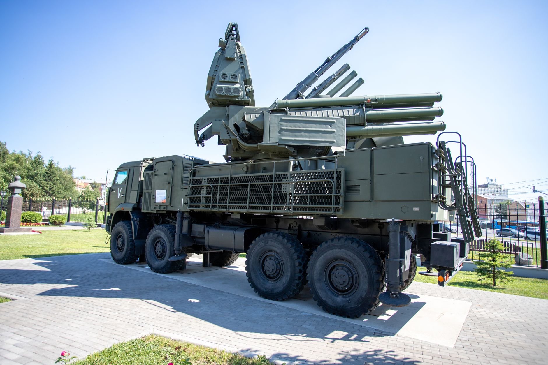 Outdoor display of a military missile defense system on a sunny day,
