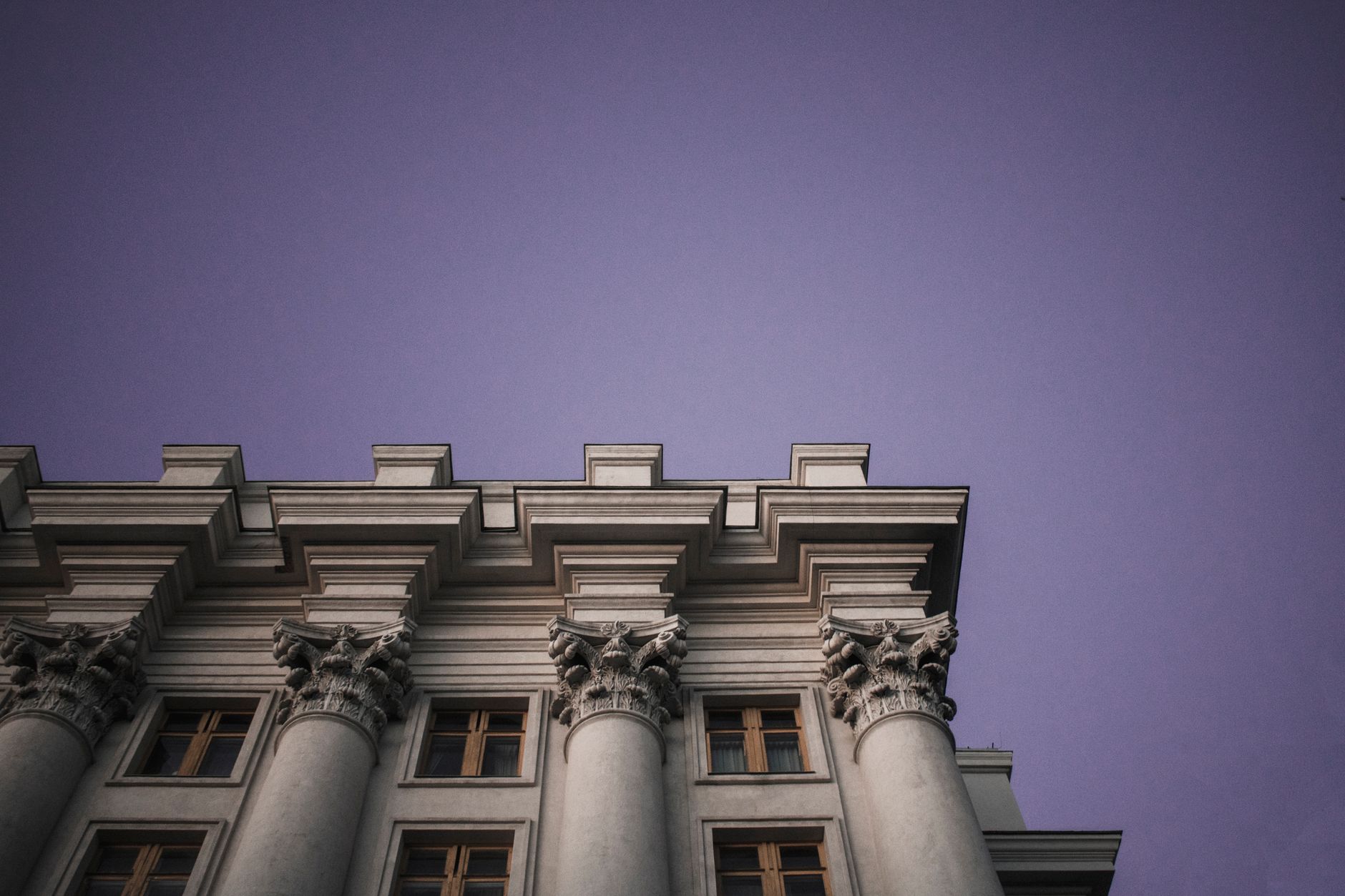 Majestic architectural columns against a twilight sky in Kyiv, Ukraine.