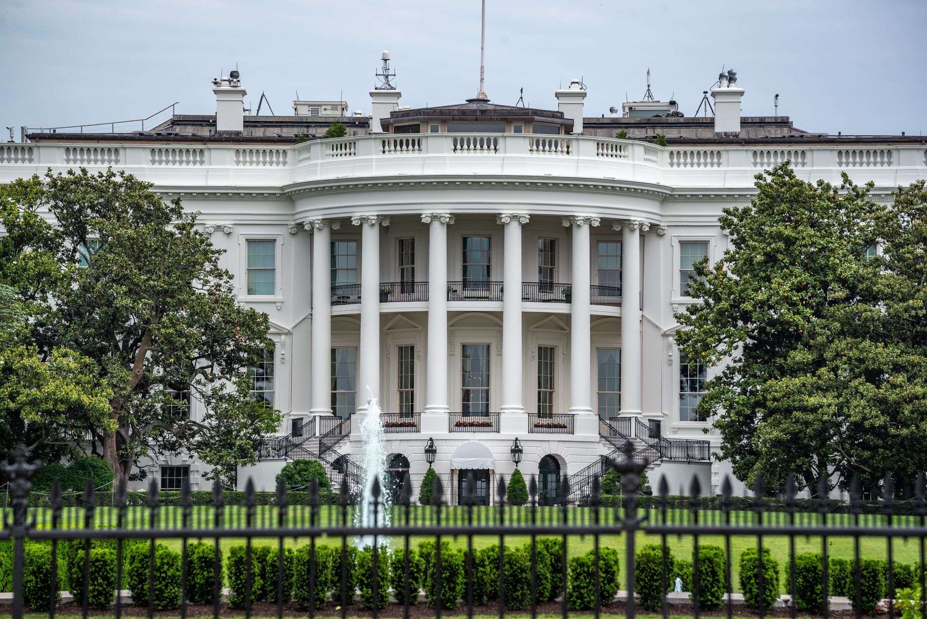 A classic view of the White House in Washington DC with lush