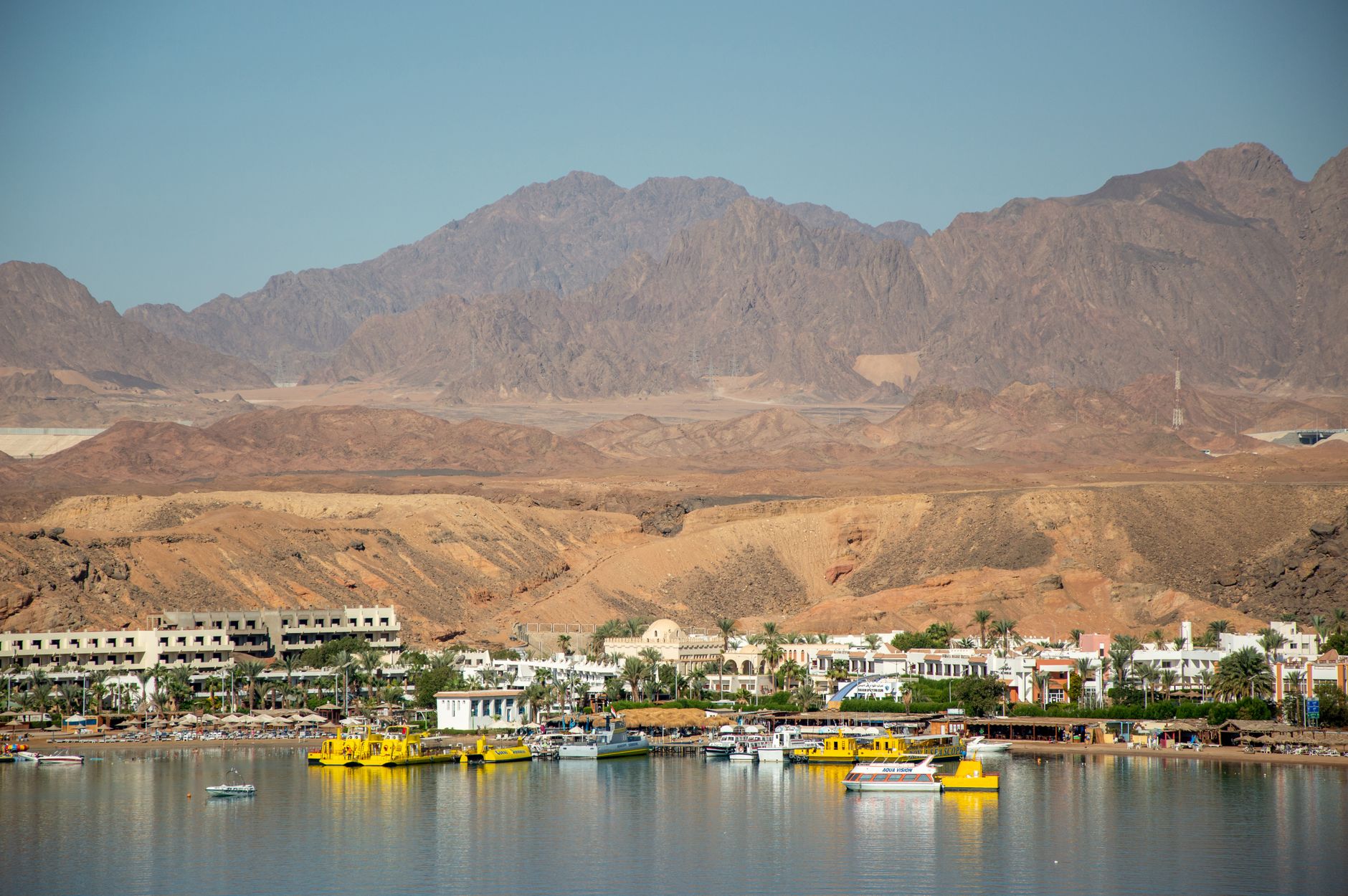 Explore the charming desert landscapes merging with the Red Sea coast at