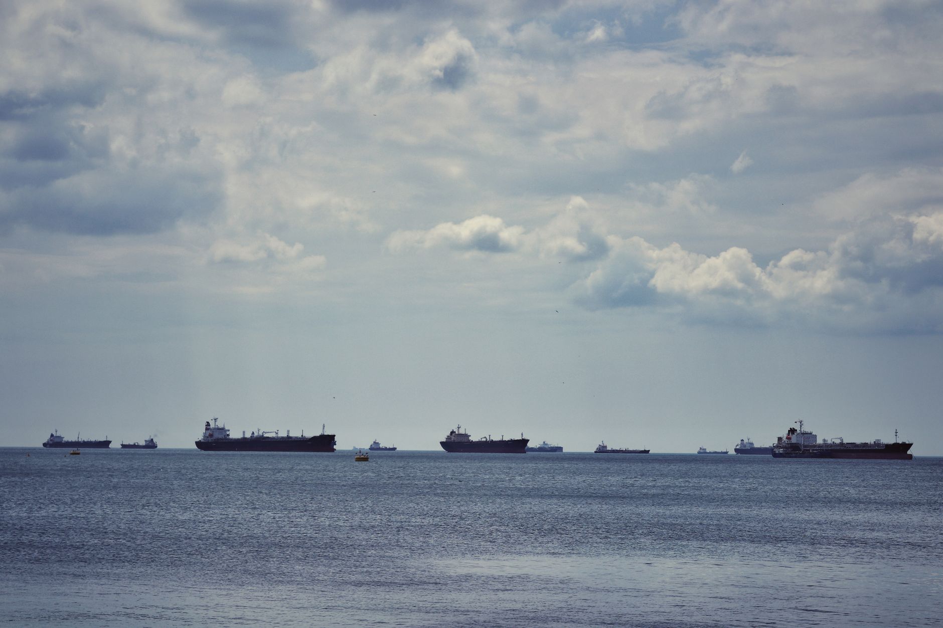 Scenic view of multiple cargo ships anchored on the Bosphorus Strait under