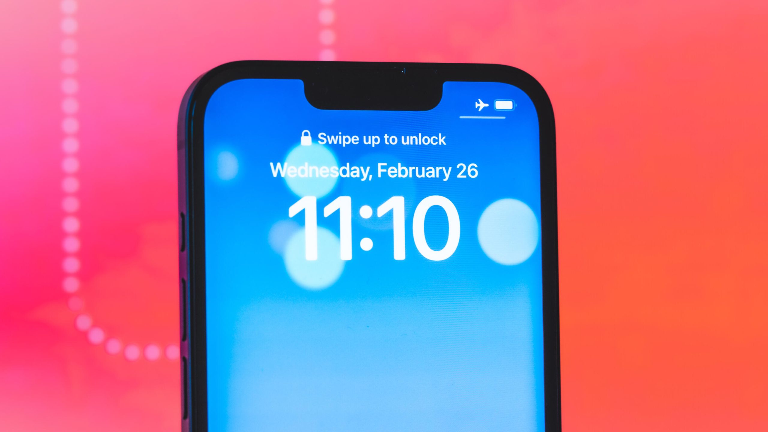 iPhone 16E showing 11:10 on the lock screen clock