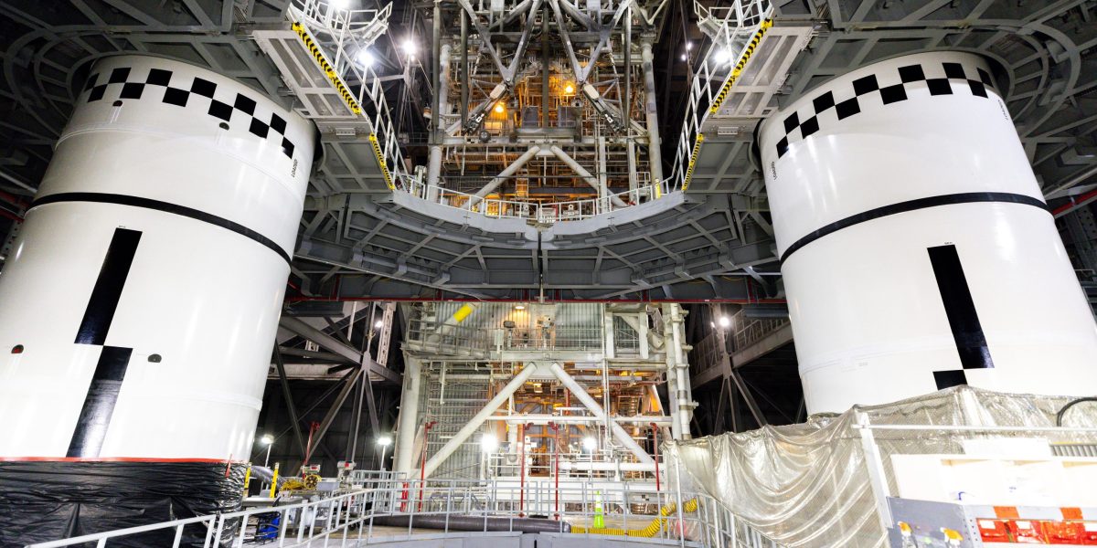 The final left and right forward solid rocket booster motor segments for Artemis III are integrated onto the mobile launcher for the SLS (Space Launch System) rocket on Thursday, Sept. 24, 2026 at NAS