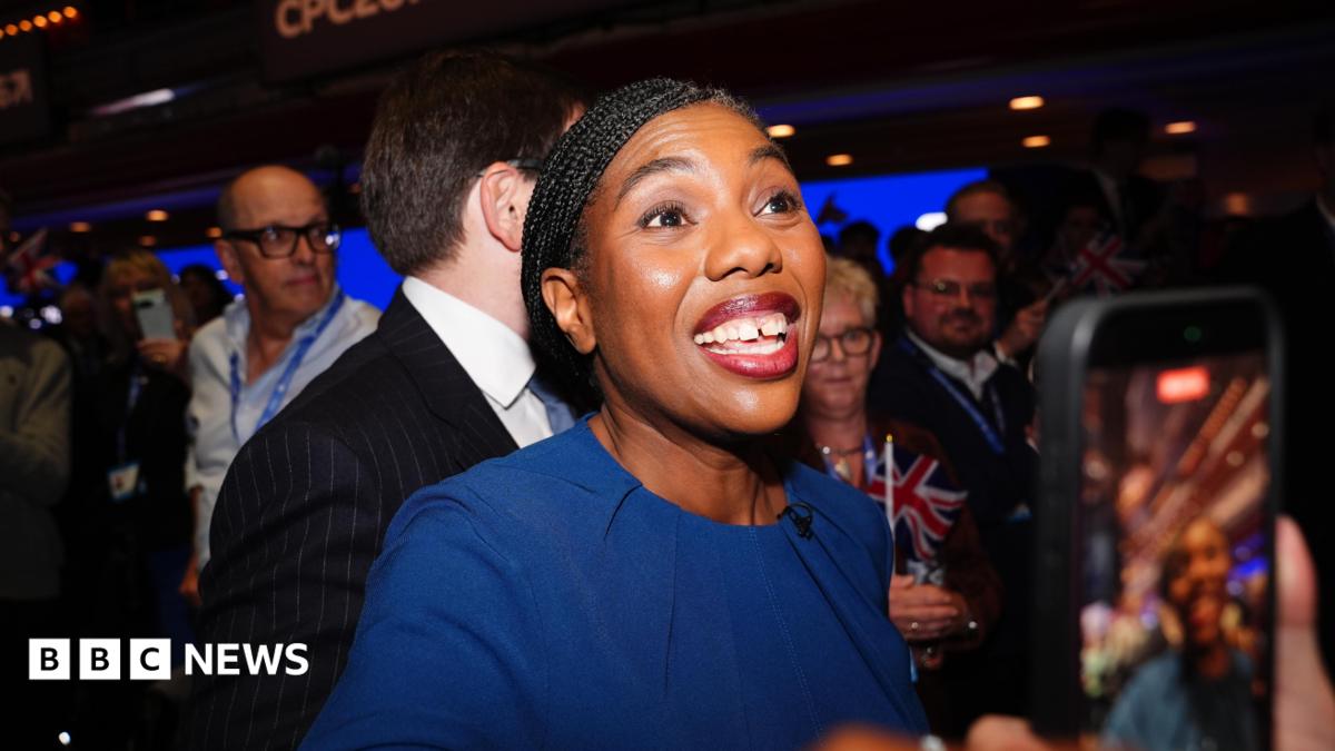 Kemi Badenoch grins at supporters after leaving the stage at the Conservative Party conference