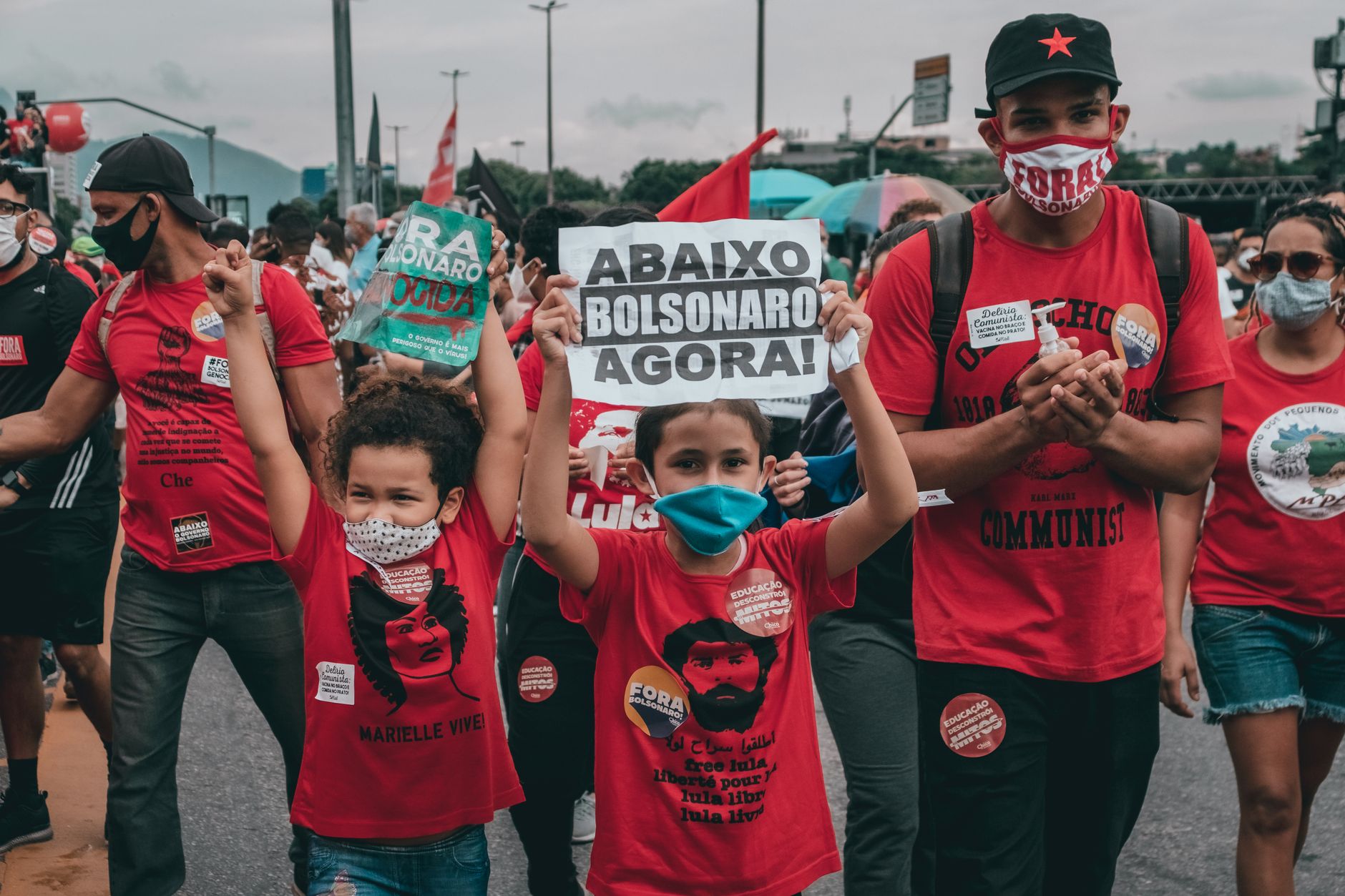 Protesters rallying against Bolsonaro in Rio de Janeiro, showing signs and wearing
