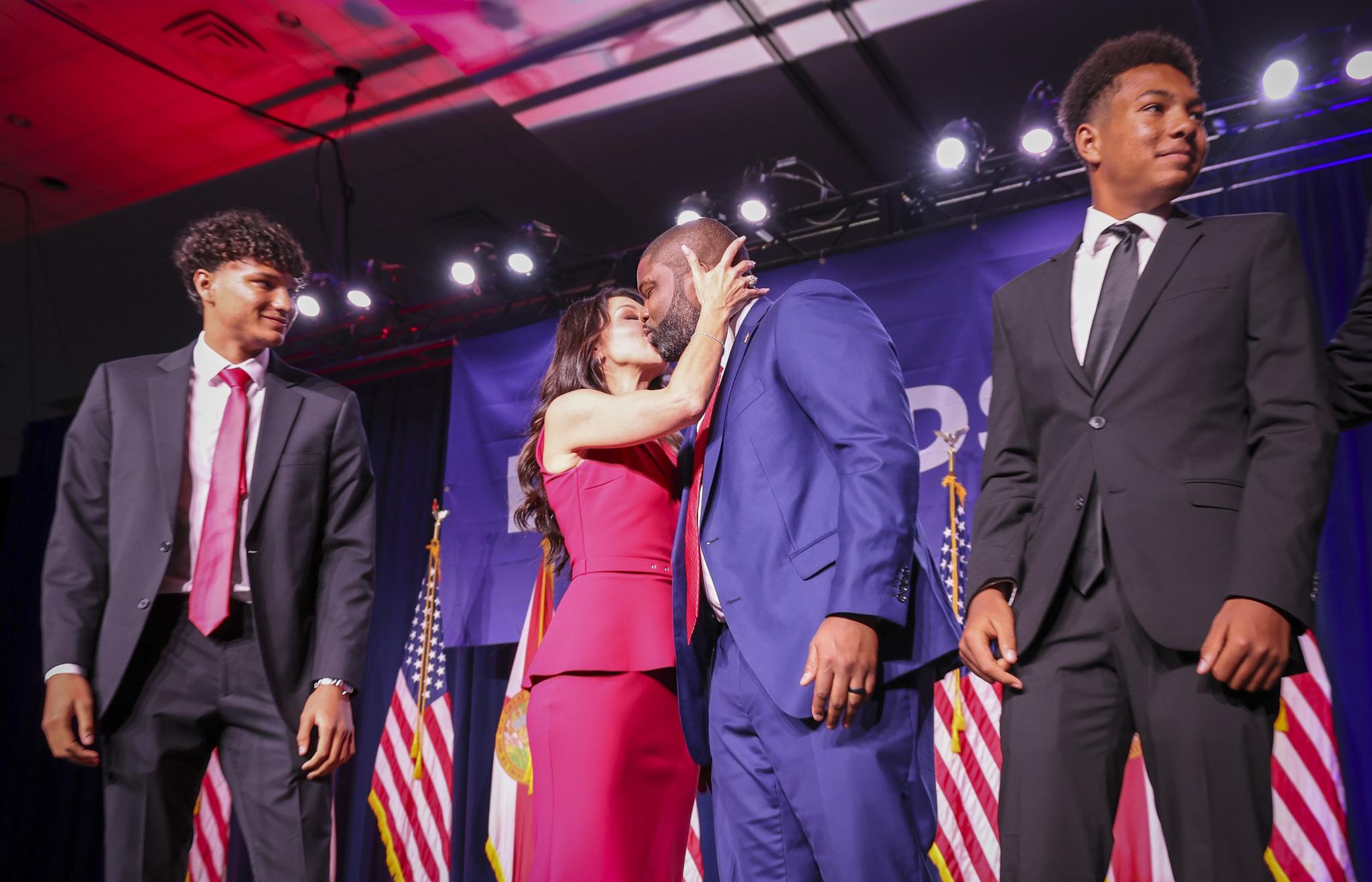 Florida gubernatorial candidate Byron Donalds kisses his wife Erika Donalds as their
