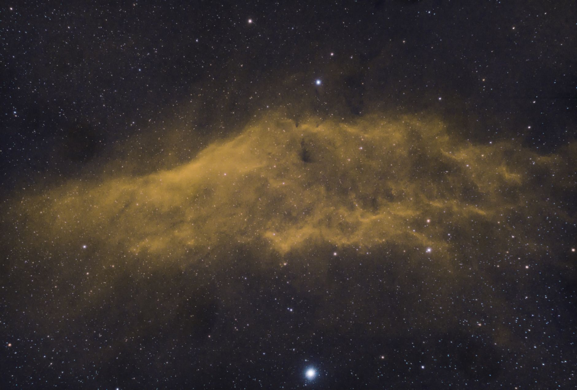 Captivating image of a yellow nebula amidst a starry night sky, showcasing