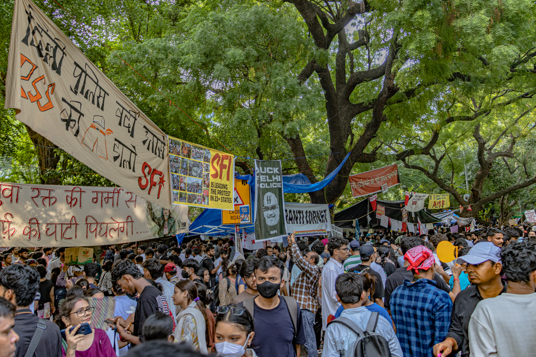 Students gather in New Delhi for a peaceful protest, displaying banners and