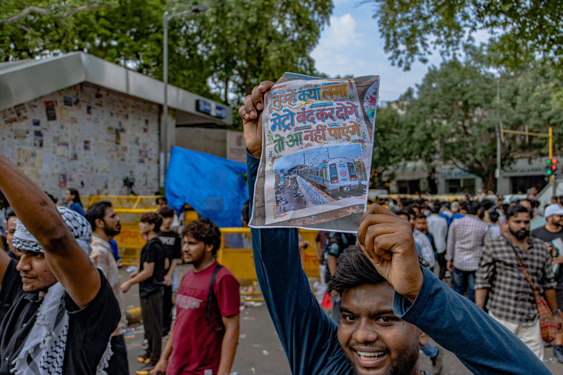 Protesters congregate at Jantar Mantar, New Delhi, holding up signs for peaceful