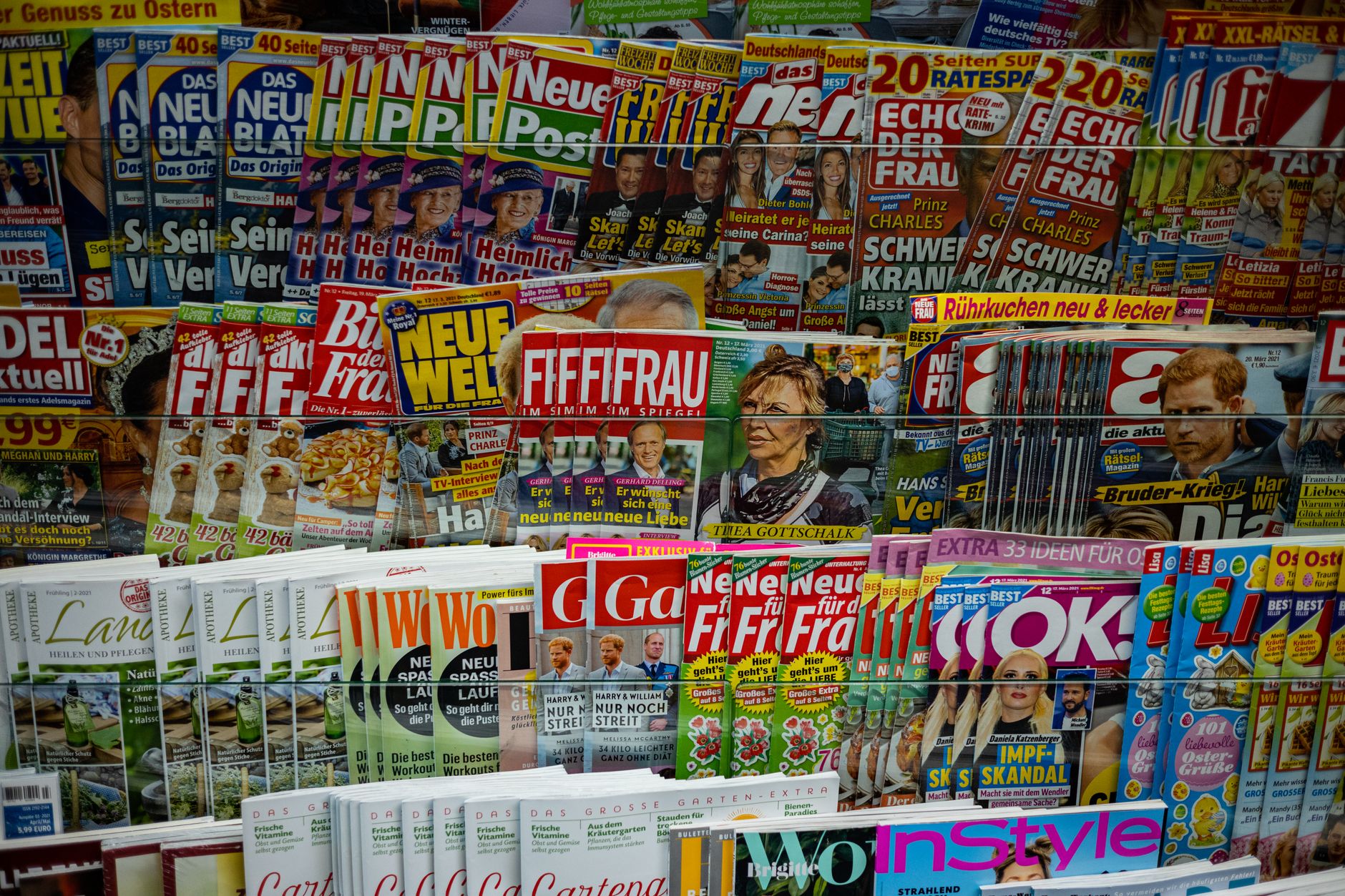 A vibrant display of magazines in a newsstand, showcasing various colorful covers