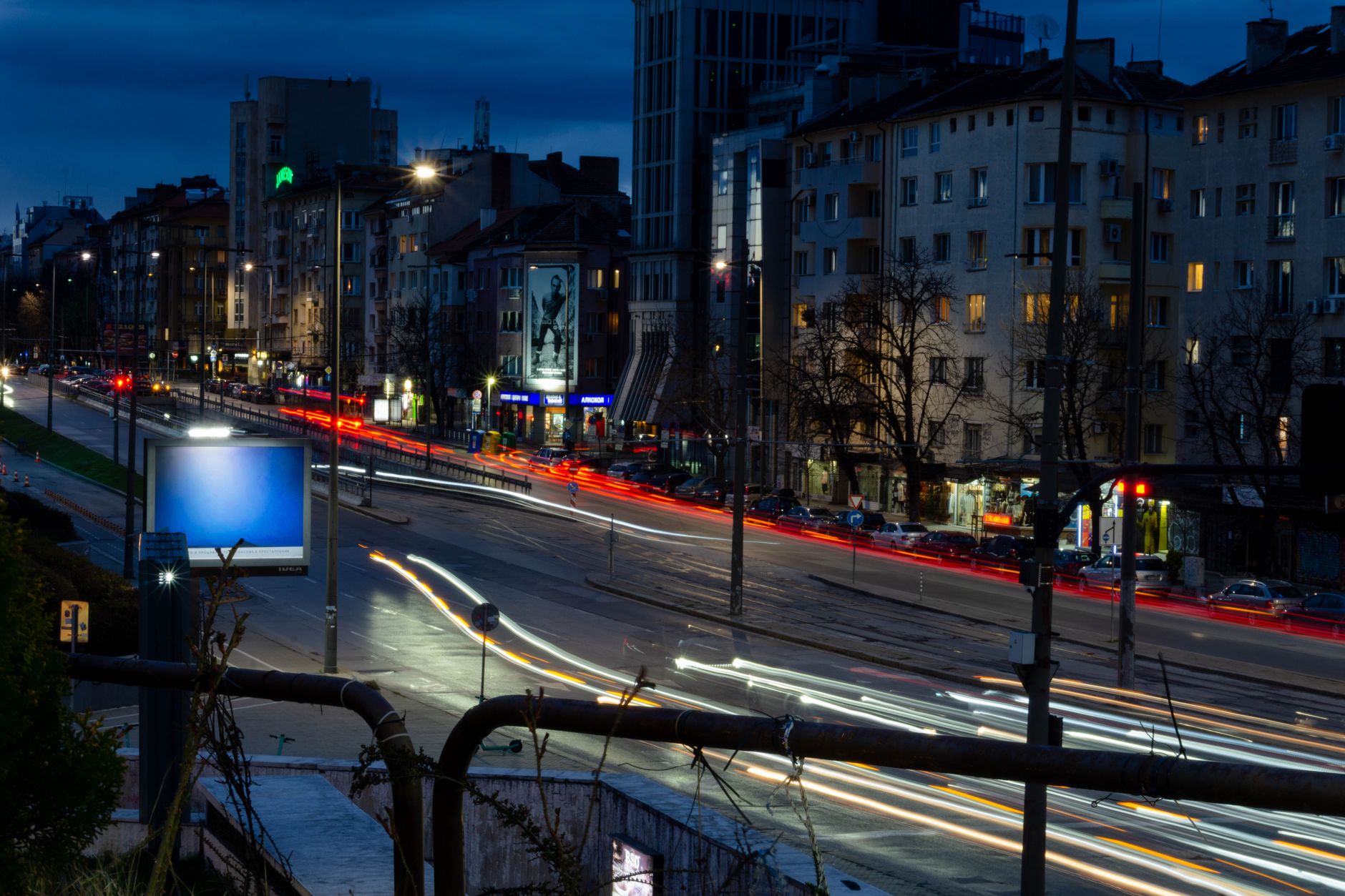 Long exposure of Sofia boulevard at night with vibrant city lights and