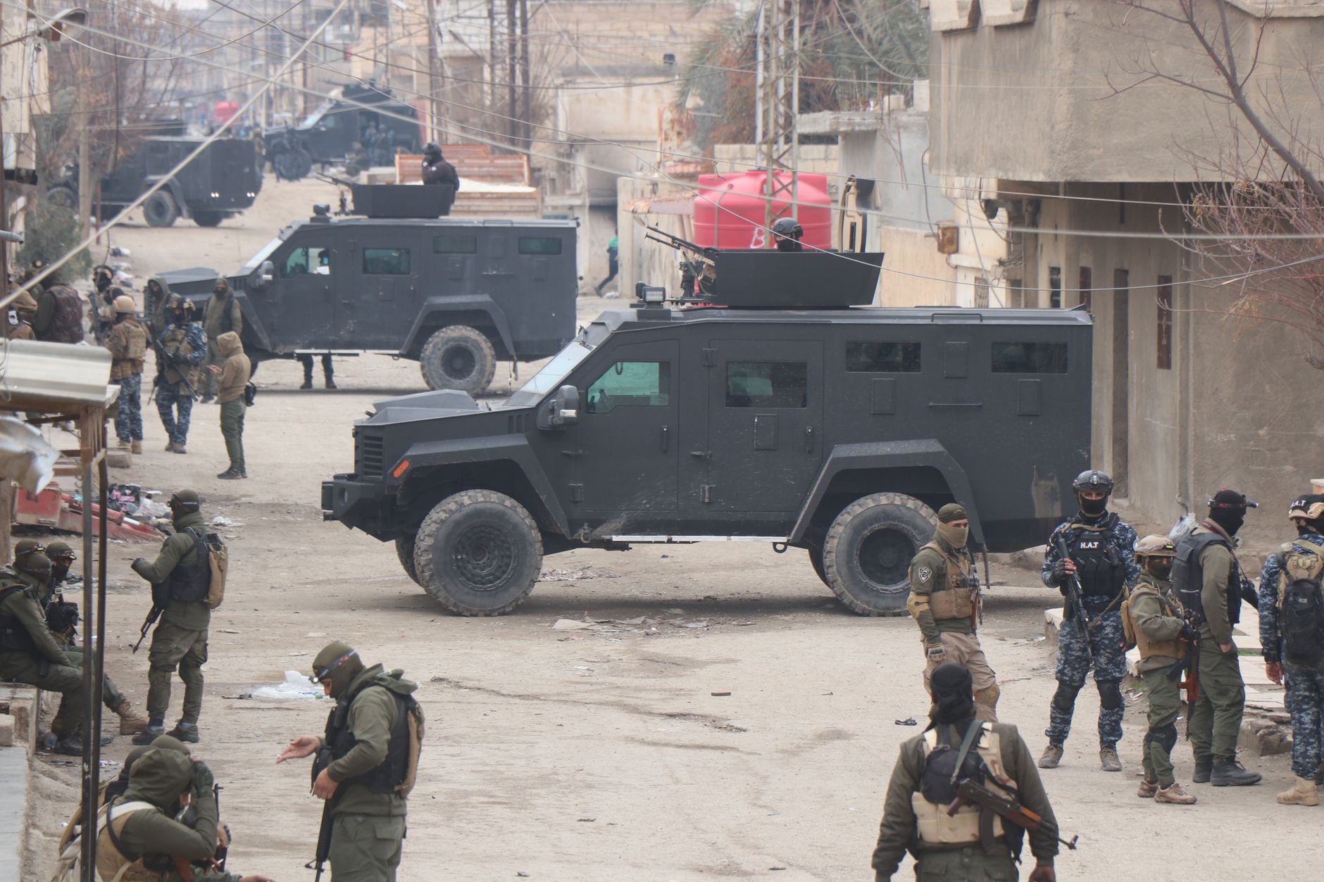 Armed forces in armored vehicles on the streets of Al Hasakah during