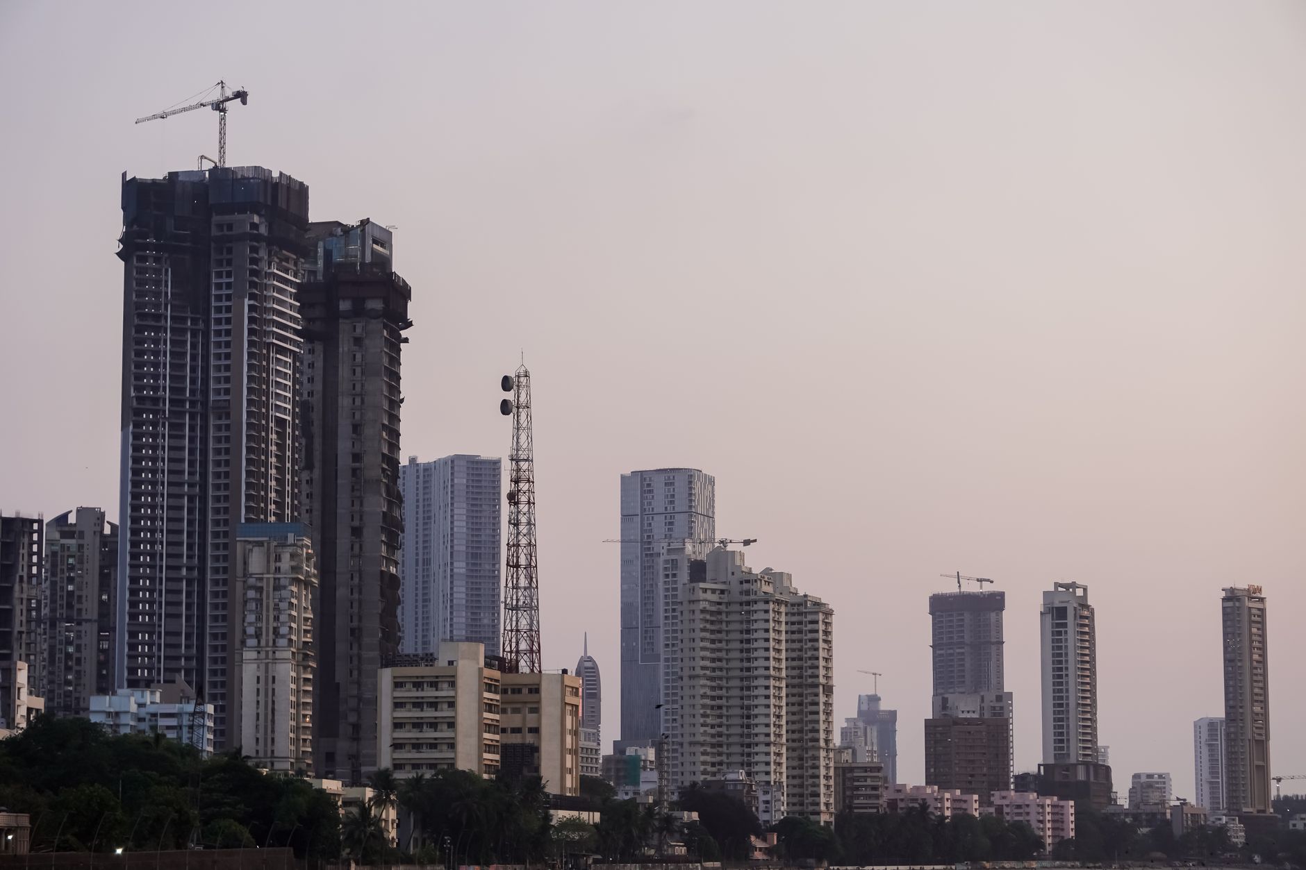 Twilight view of Mumbai's skyline showcasing tall buildings and a serene evening