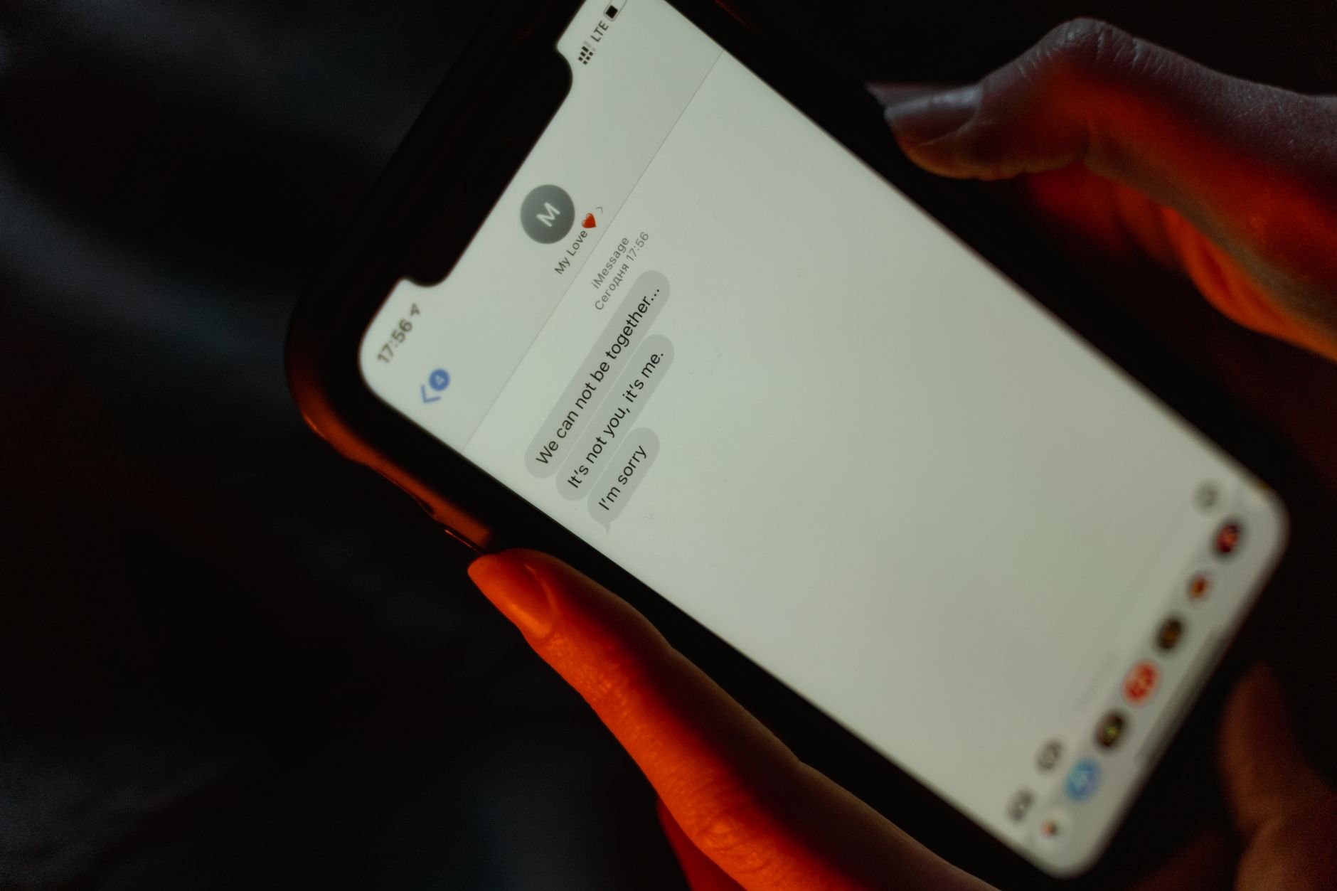 A close-up view of a text message on a smartphone screen displaying