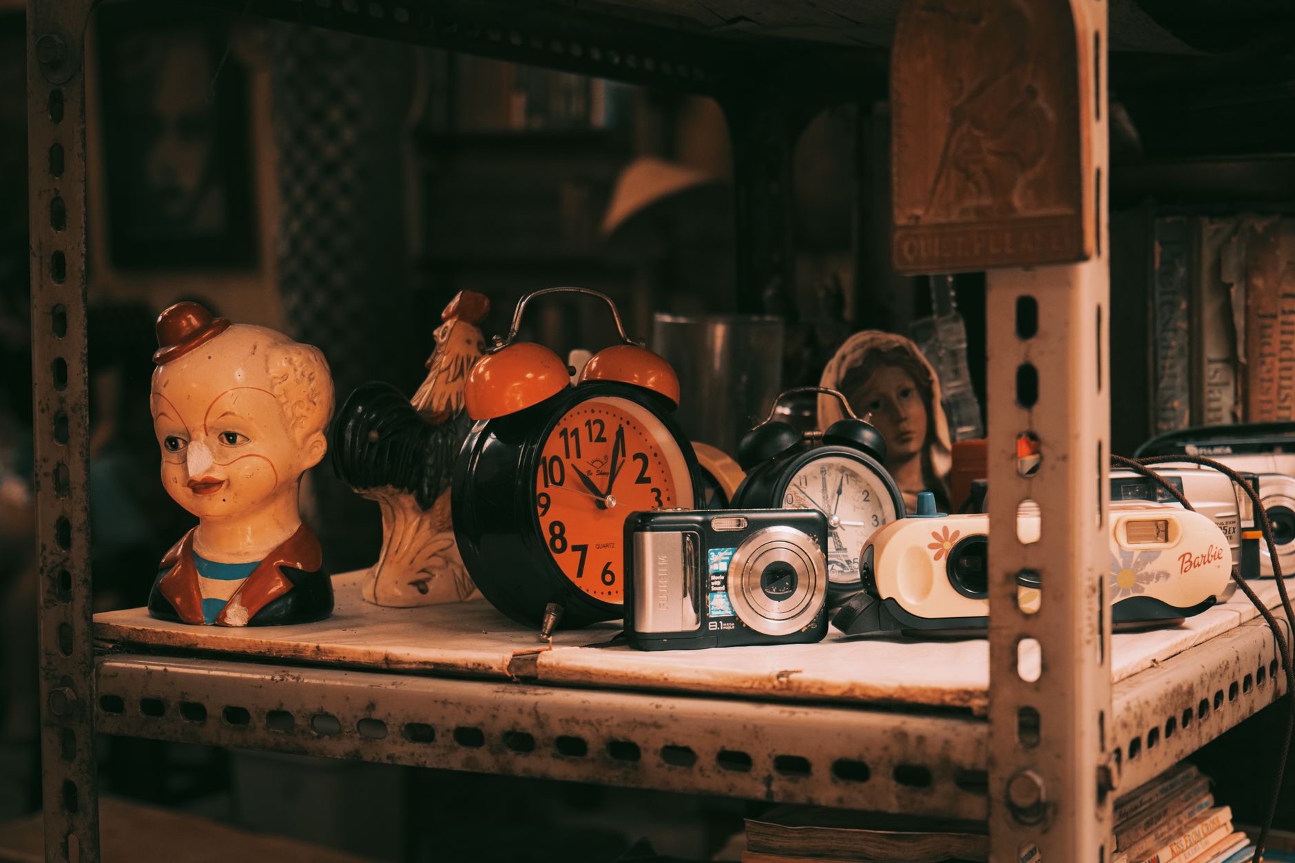 A rustic shelf displays vintage clocks, cameras, and quirky figures, evoking nostalgia