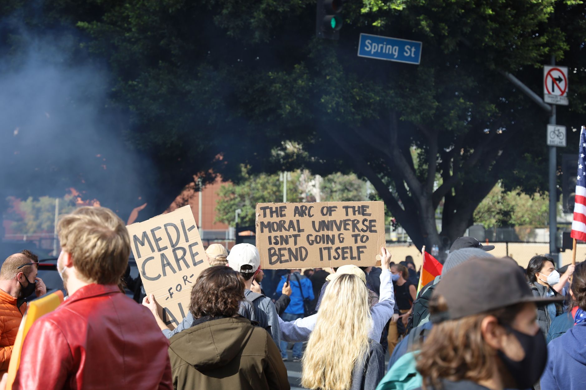 Protesters gather on Los Angeles Spring Street, advocating for social change.
