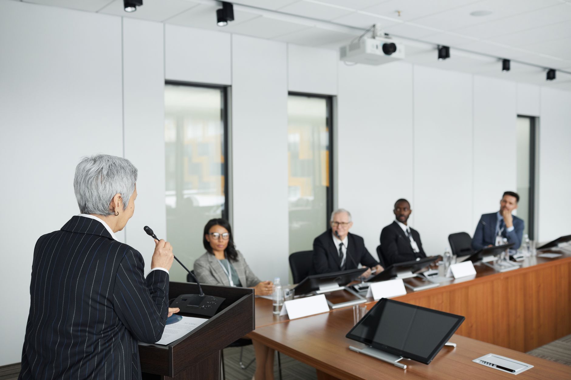 A diverse group of professionals engaging in a business meeting in a
