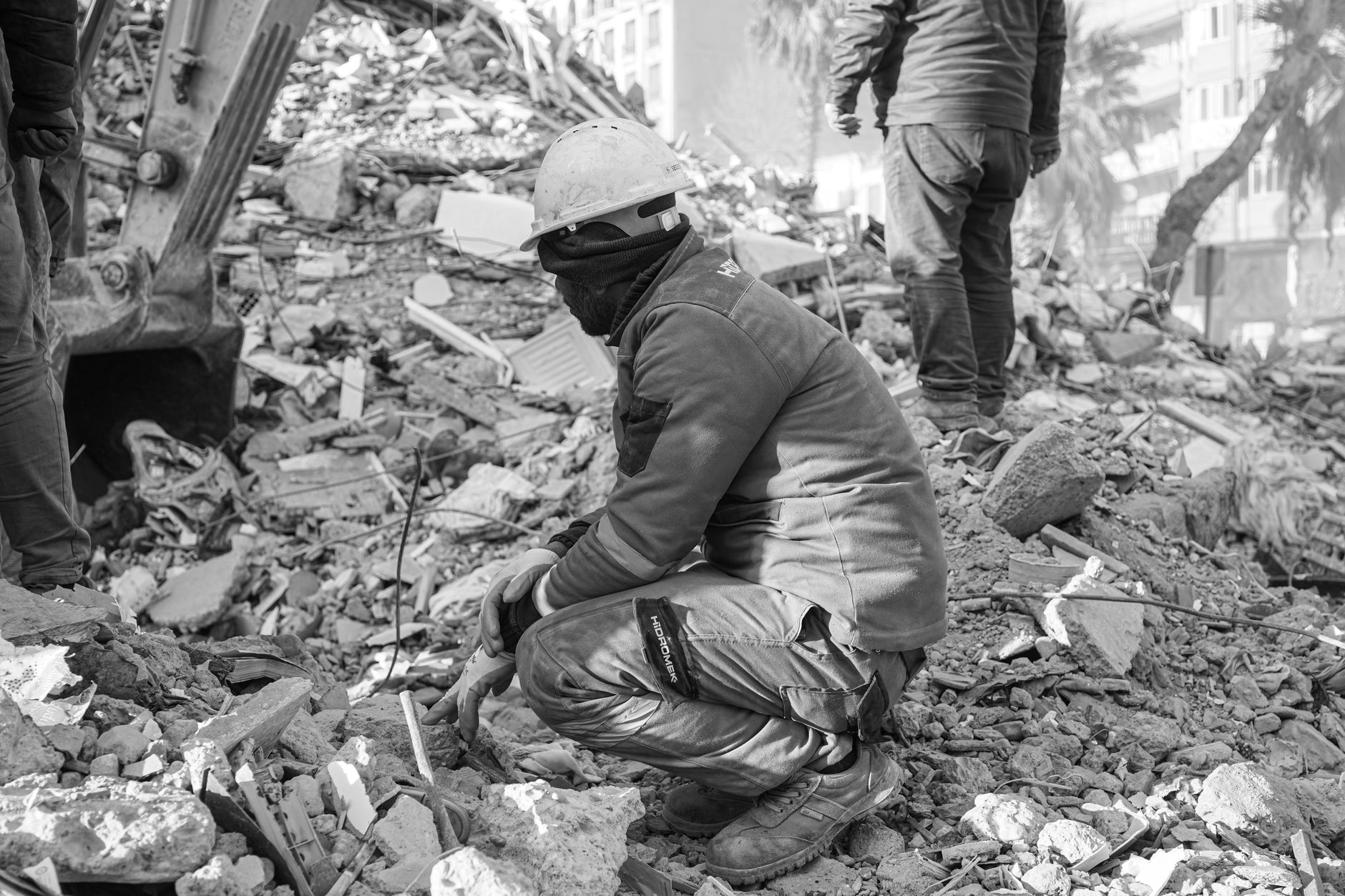 Rescue workers amidst rubble after an earthquake in Turkey, capturing resilience and