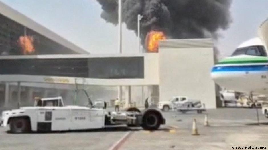 Smoke and flames rise from the main international airport in Riyadh on October 8, in this screengrab obtained from a social media video.