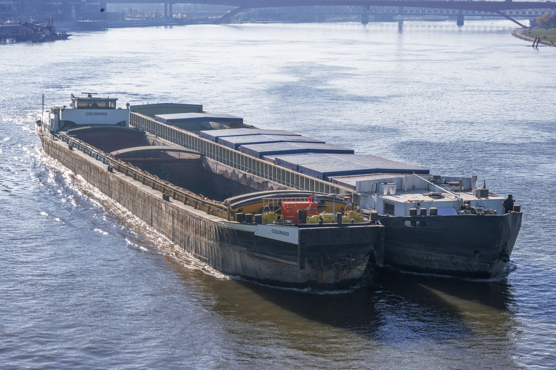 Cargo vessels sailing on the Danube in Belgrade, showcasing the bustling industrial