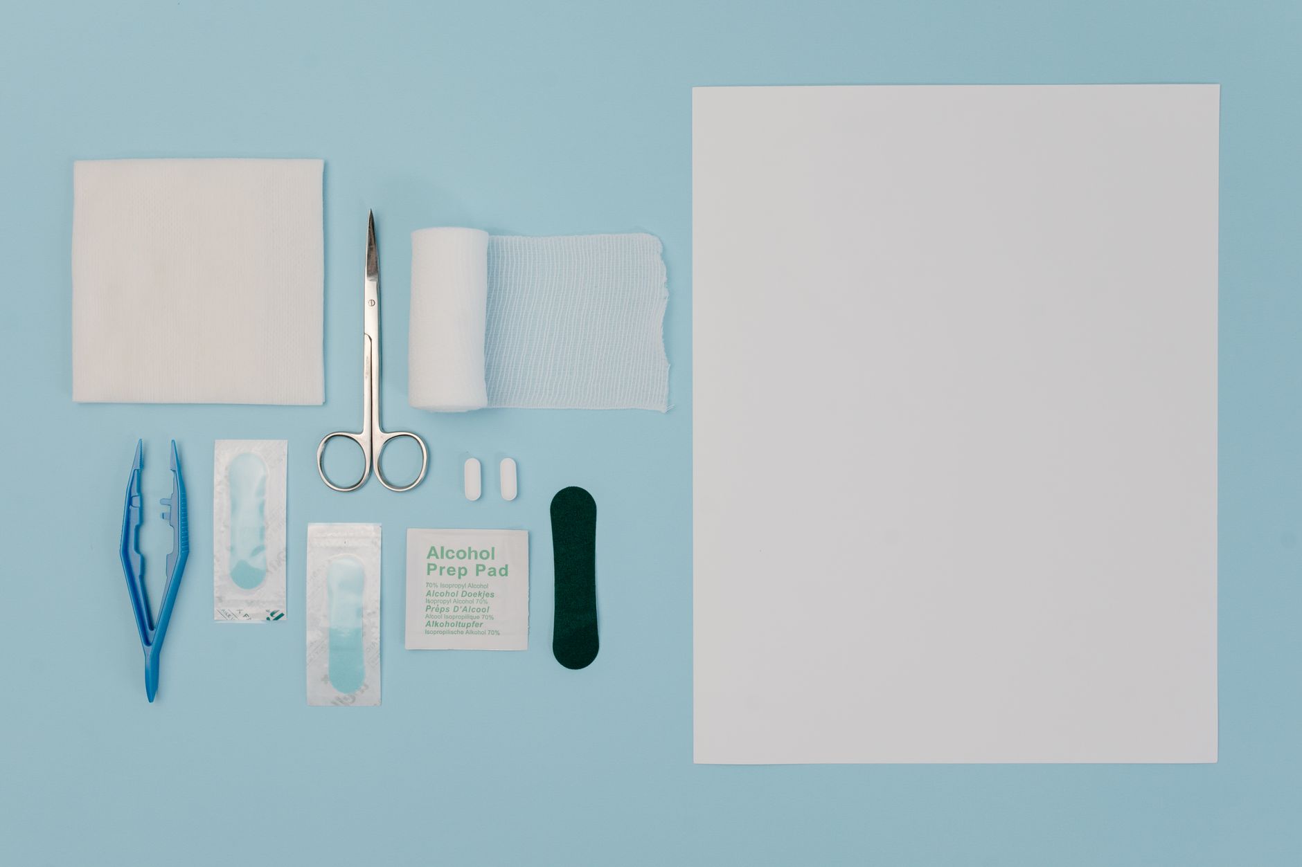 Organized display of medical tools and supplies including gauze, scissors, and bandages
