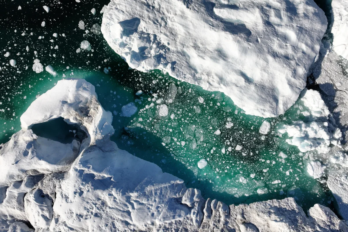Aerial view of melting icebergs lie in the Ilulissat Icefjord near the