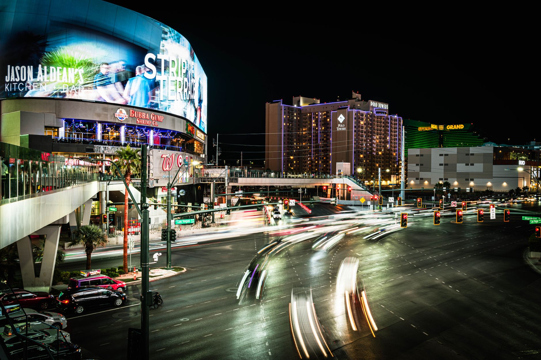 Dynamic night scene on the Las Vegas Strip featuring vibrant lights and