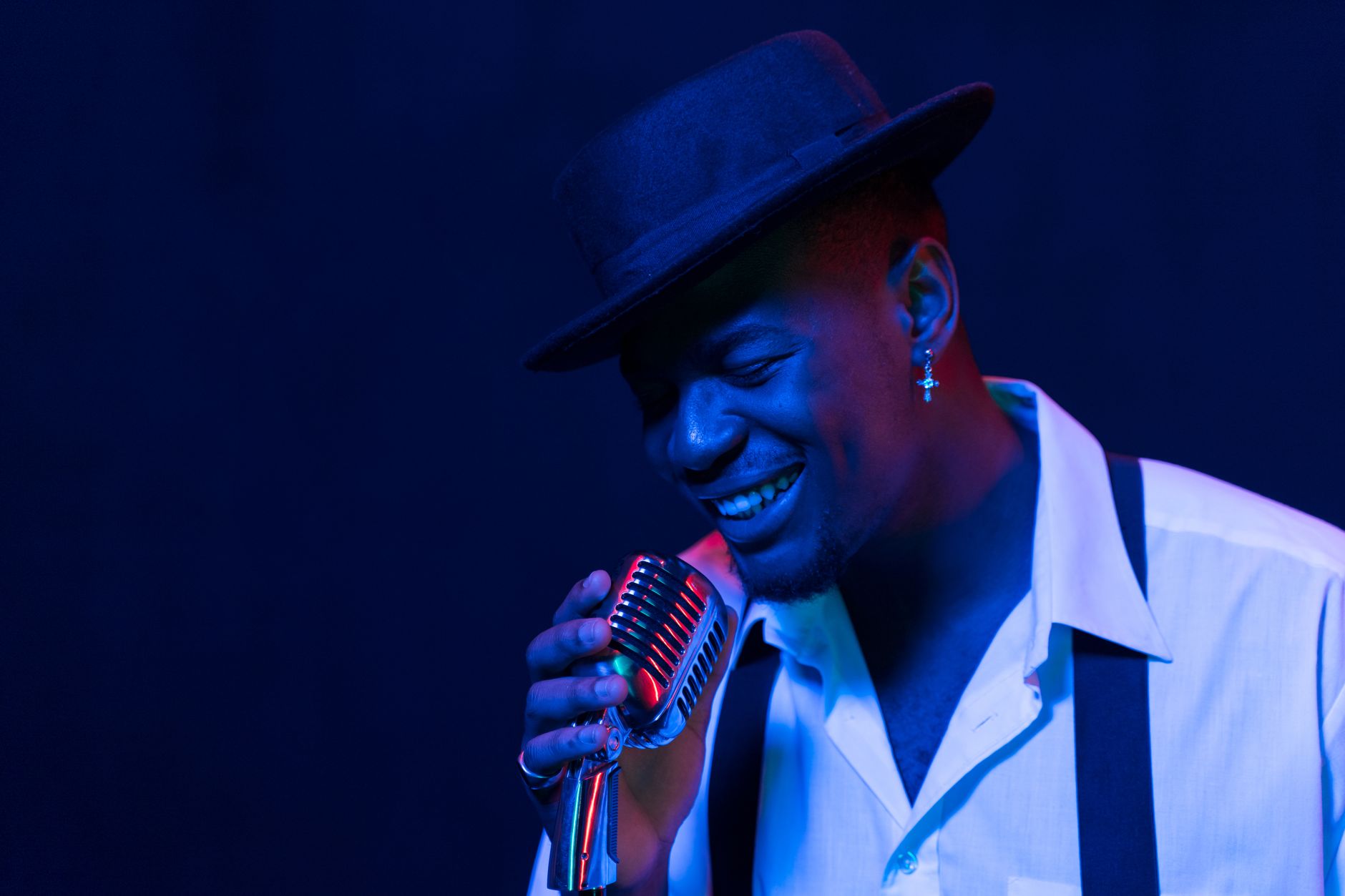 A vibrant portrait of an African American singer emotively performing with a